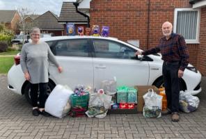 Clive Rutland handing over eggs.